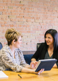 Two women executives at a table