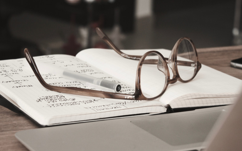 glasses sitting on a notebook