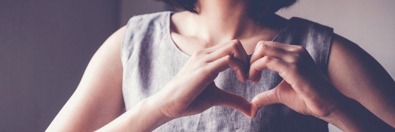 woman hand on heart 800x267 woman with hand on heart