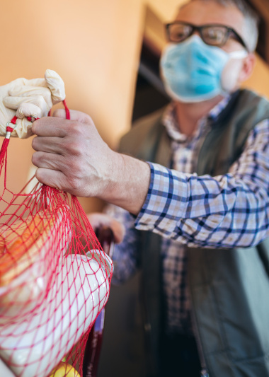 man accepting groceries 
