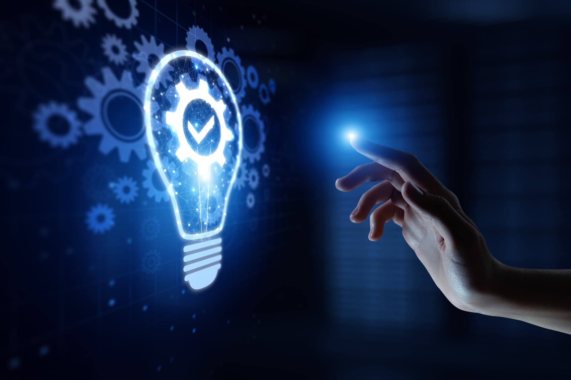 hand reaching out to lightbulb on screen