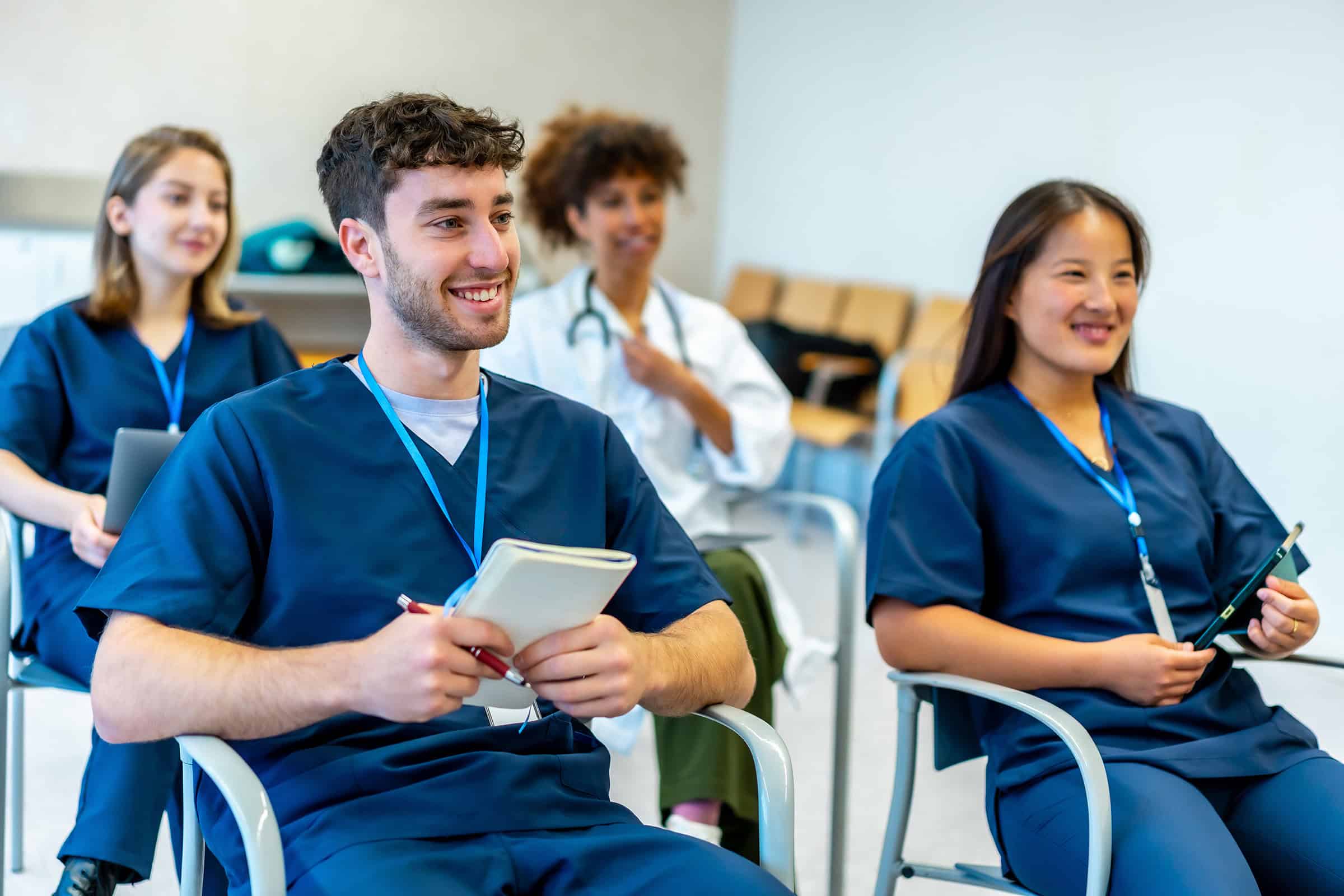 Clinicians sitting in a classroom