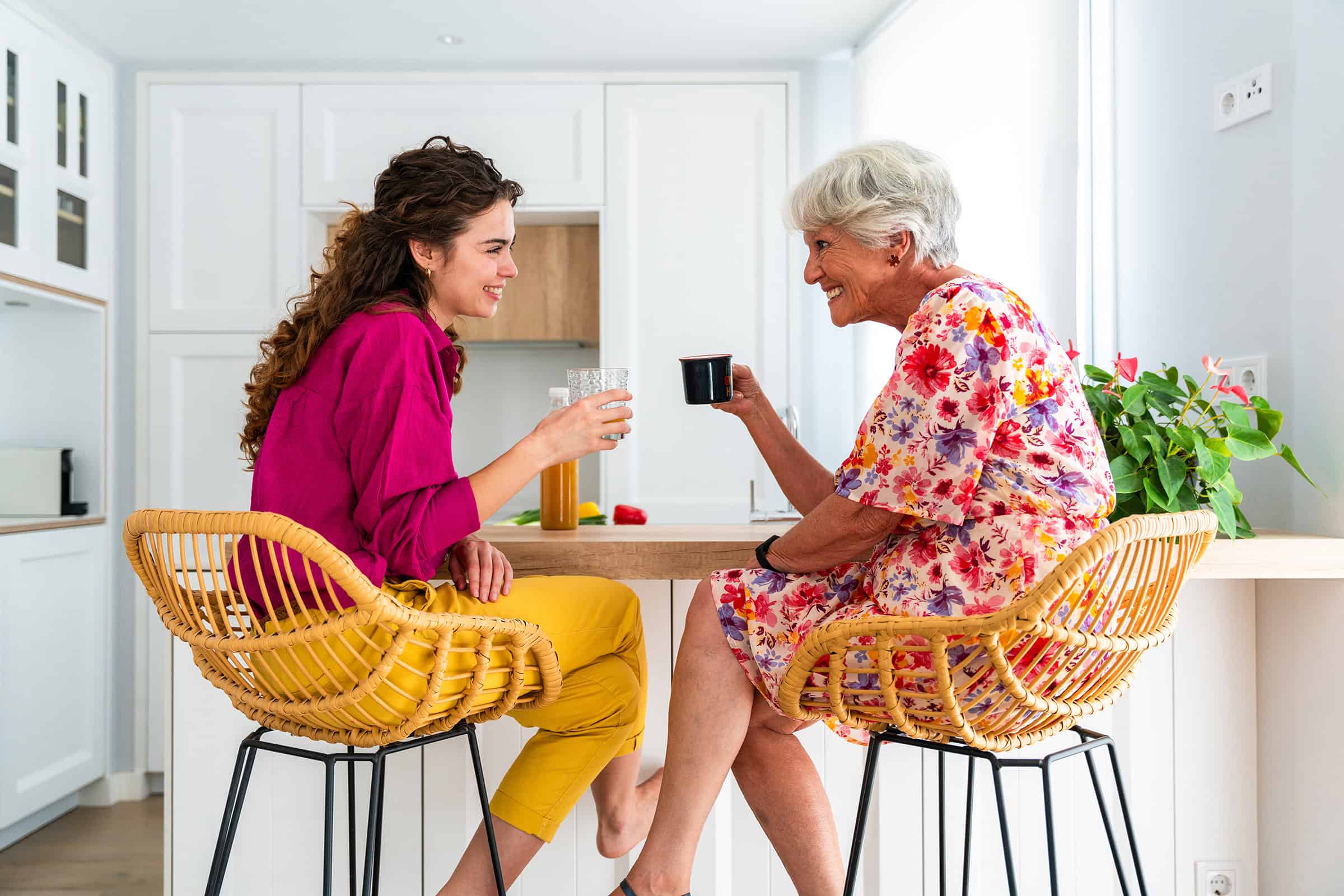 Two women drinking coffee together