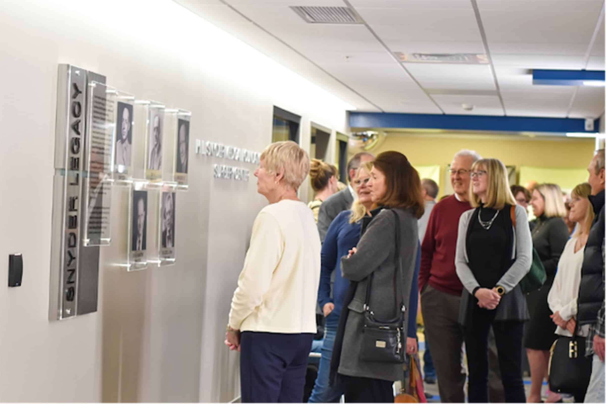 Donors viewing a legacy wall at H.L. Snyder Medical Foundation Surgery Center