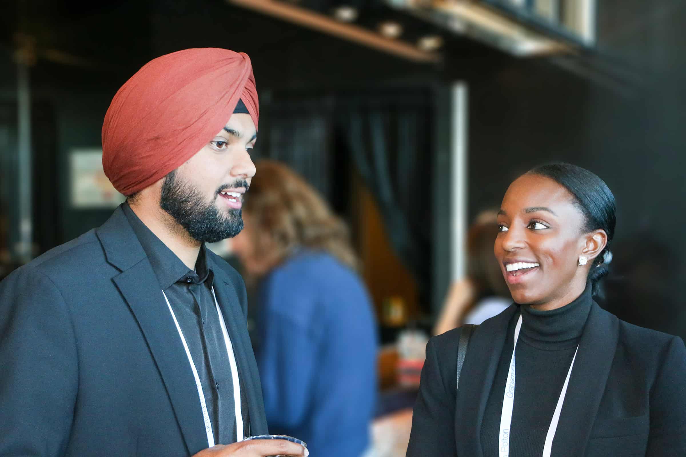 Two people chatting at an event