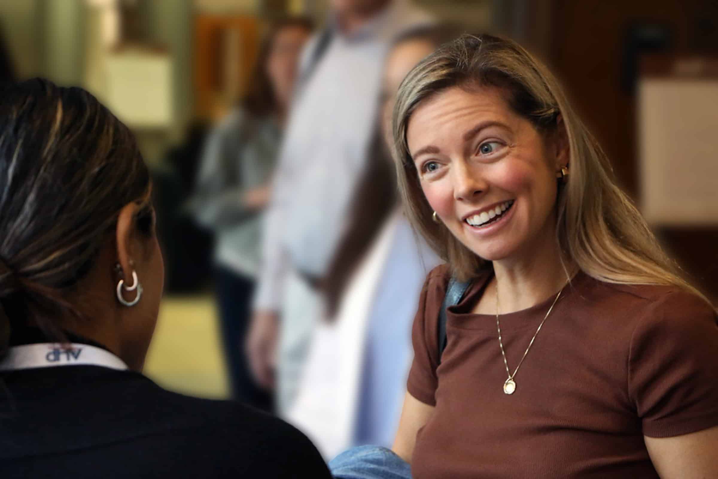 woman smiling at a second woman